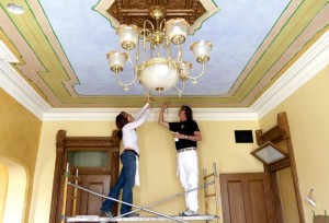 Hugh Alan Luck, right, and Michele Peraino, both of Wenonah, N.J., paint a ceiling inside the historic Whipple House on Saturday in Cheyenne. The building is being restored and will house Renée Hansen and Associates, whose practice employs 14 employees who council children, families and couples. Blaine McCartney/Wyoming Tribune Eagle